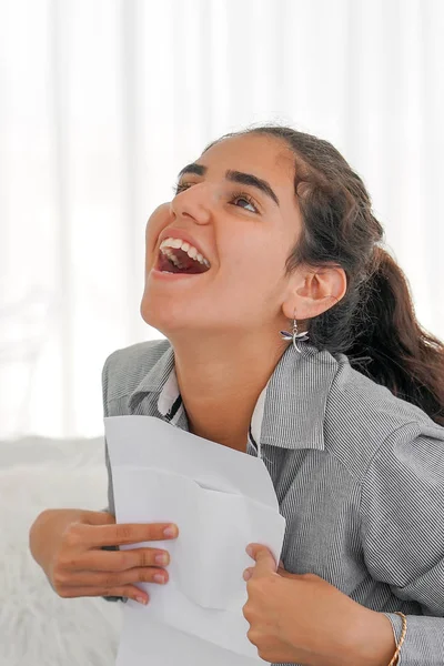 Happy entrepreneur woman reading good news in a letter. — Stock Photo, Image