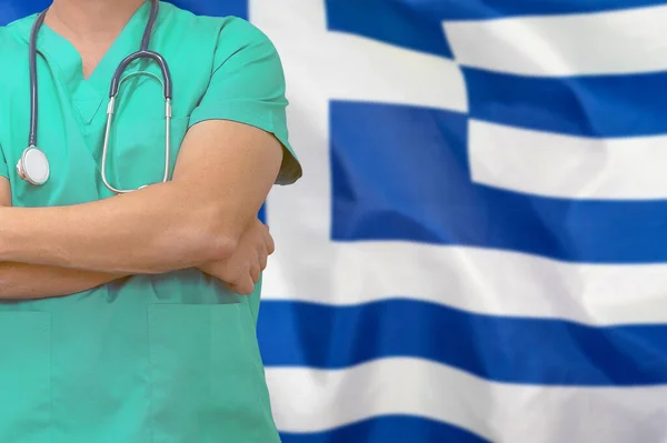 Male surgeon or doctor with stethoscope on the background of the Greece flag. Health care and medical concept. Surgery concept in Greece.