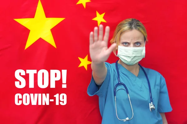 Female doctor or nurse in bandage showing stop sign by hand, looking at camera on china flag background. Concept against virus, coronavirus and infection diseases. Banner with the text Stop! COVIN-19