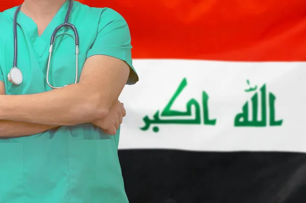 Male surgeon or doctor with stethoscope on the background of the Iraq flag. Health care and medical concept. Surgery concept in Iraq.