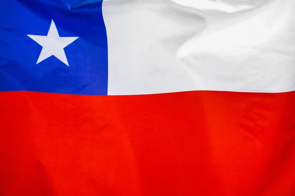 Fabric texture flag of Chile. Flag of Chile waving in the wind. Chile flag is depicted on a sports cloth fabric with many folds. Sport team banner.