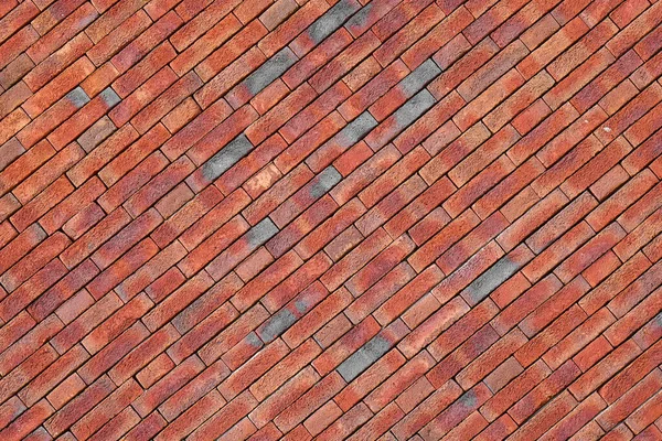 Photo Sloping Red Brick Wall Red Stone Wall Background Texture — Stock Photo, Image