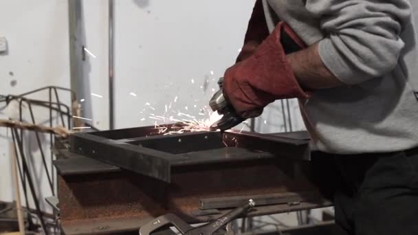 Close up of a man working with grinder tool - sparks flying — Stock Video