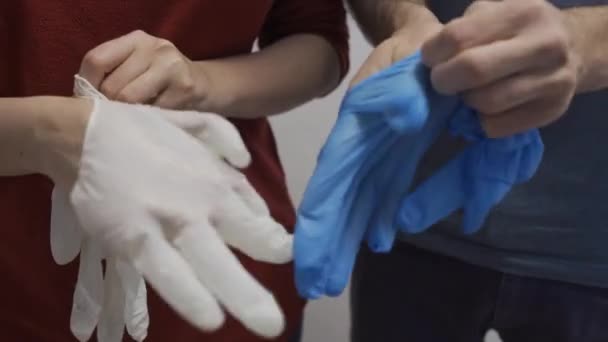 Two People Put Rubber Latex Gloves Hands — Stock Video