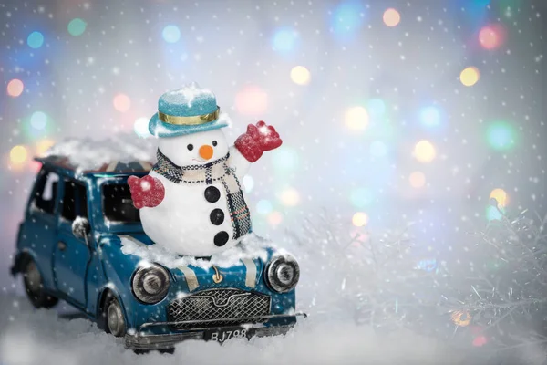 Snowman and mini car — Stock Photo, Image