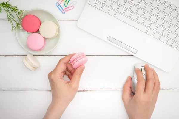 macarons on white table background
