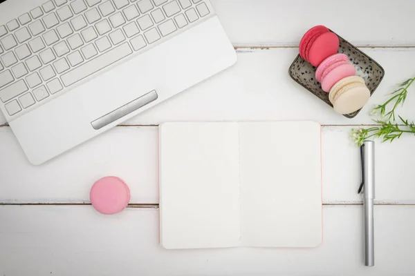 macarons on white table background