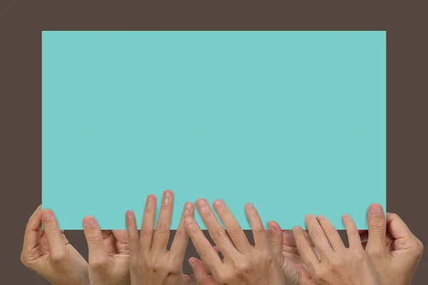 Many hands holding a white blank poster