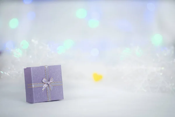 Gift box on the white fur — Stock Photo, Image