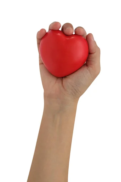 Mano sosteniendo un corazón rojo — Foto de Stock