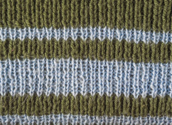 올리브 녹색 양모 손을 밝은 파란색 줄무늬 ab와 텍스처 — 스톡 사진