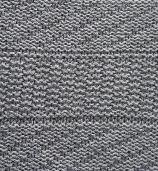 Graue Wolle handgestrickte Textur abstrakter Hintergrund — Stockfoto