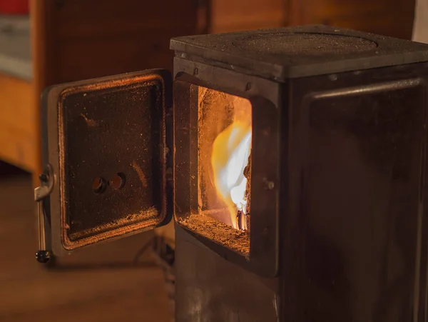 Old metal open stove door with burning flame wood — Stock Photo, Image