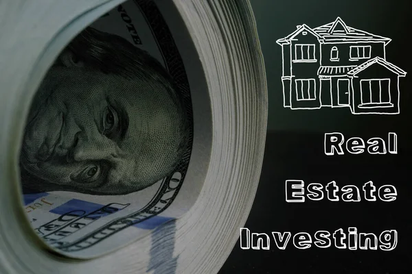 Real Estate Investing is shown on the conceptual business photo