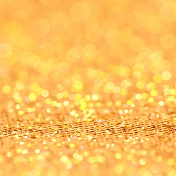 Bokeh. Kerstmis gouden knipperende achtergrond — Stockfoto