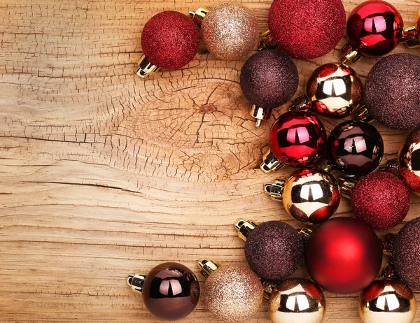 Christmas Balls Over Wooden Background. Royalty Free Stock Images