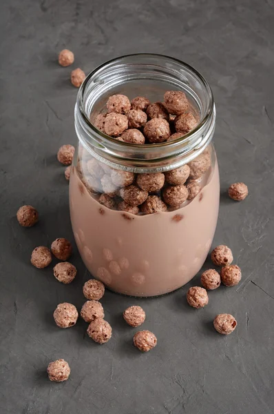 Chocolate milk with chocolate cereal balls — Stock Photo, Image