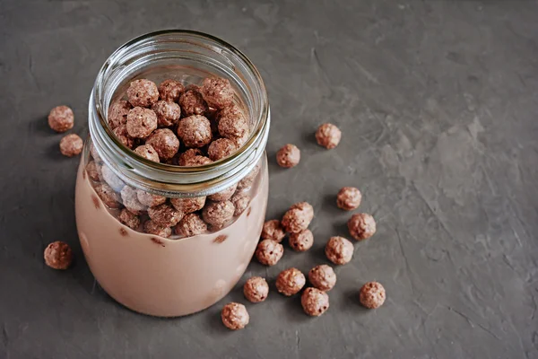 Chocolate milk with chocolate cereal balls — Stock Photo, Image