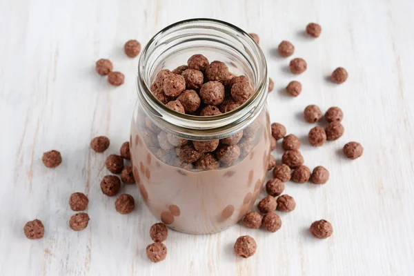 Chocolate milk with chocolate cereal balls — Stock Photo, Image