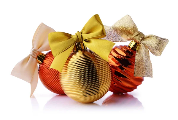 Golden and red Christmas balls with ribbon bows Stock Image