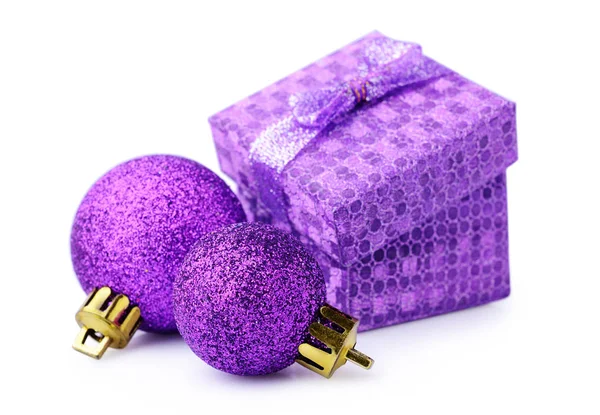 Violet gift box and Christmas balls — Stock Photo, Image