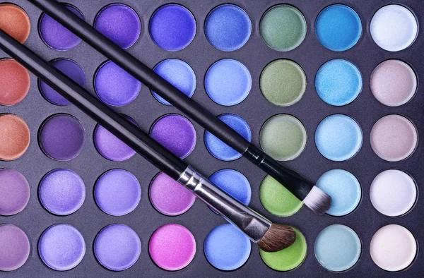 Palette of shadows and makeup brushes — Stock Photo, Image