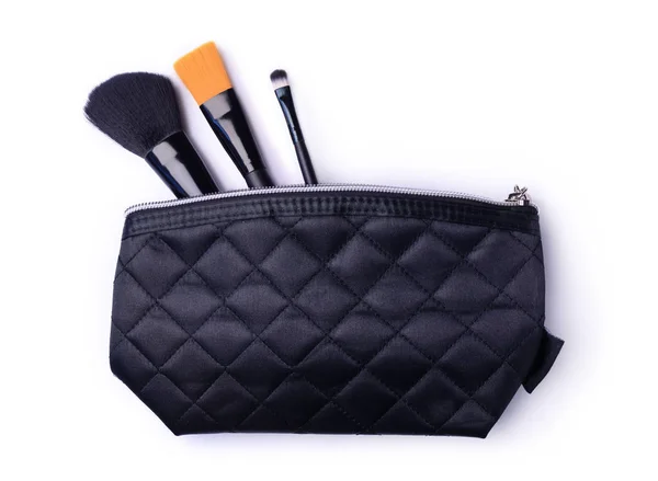Zwarte cosmetische zak met borstels voor make-up — Stockfoto