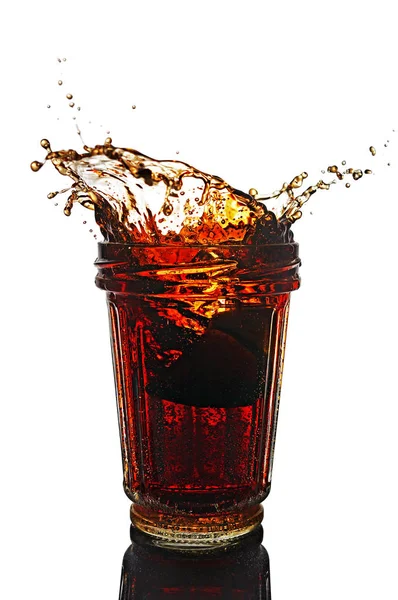 Splash in glass of cola with lemon — Stock Photo, Image