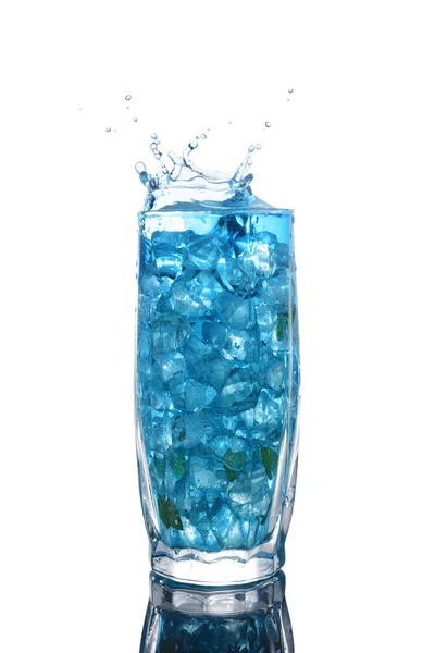 Glass of a blue alcoholic cocktail drink with ice and mint — Stock Photo, Image