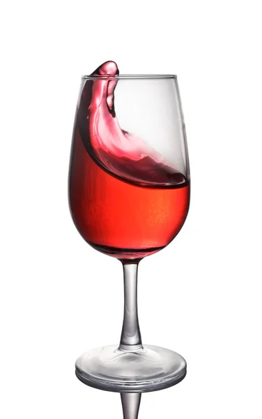 Salpicadura de un vino tinto en vaso — Foto de Stock