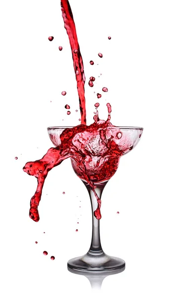 Splash in glass of a pink alcoholic cocktail drink — Stock Photo, Image