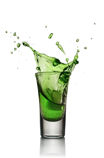 Glass of alcoholic drink with ice. Absinthe or mint liquor shot — Stock Photo, Image