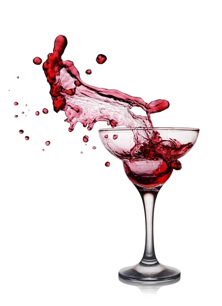Splash in glass of a pink alcoholic cocktail drink — Stock Photo, Image