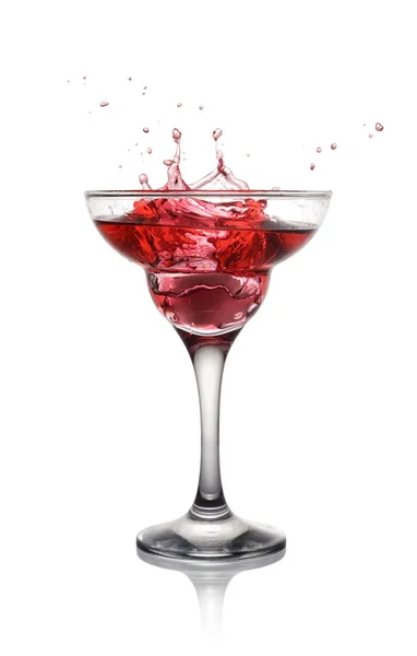 Splash in glass of a pink alcoholic cocktail drink — Stock Photo, Image