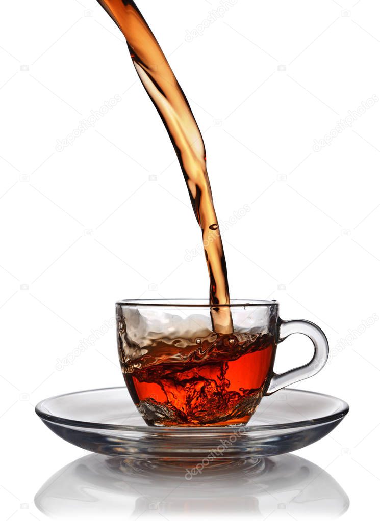 Splash in glass cup of black tea