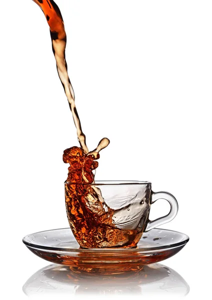 Splash in glass cup of black tea — Stock Photo, Image