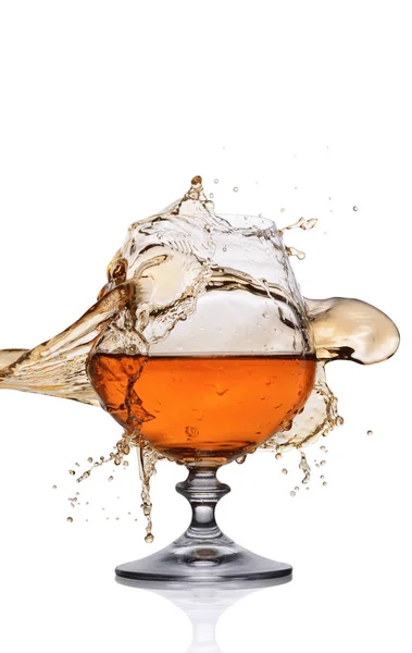 Plons in glas cognac — Stockfoto