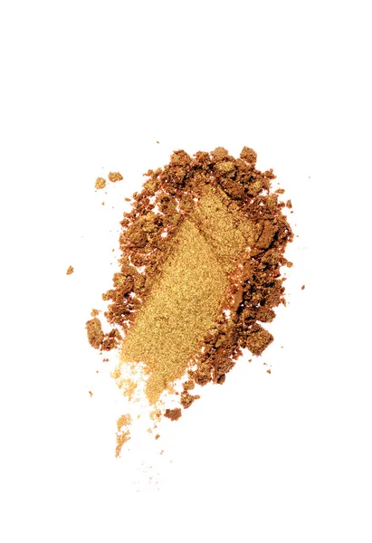 Spalmo di ombretto dorato schiacciato come campione di prodotto cosmetico — Foto Stock