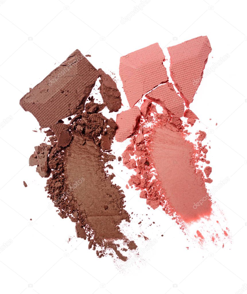 Smears of crushed brown and pink eyeshadow as sample of cosmetic product
