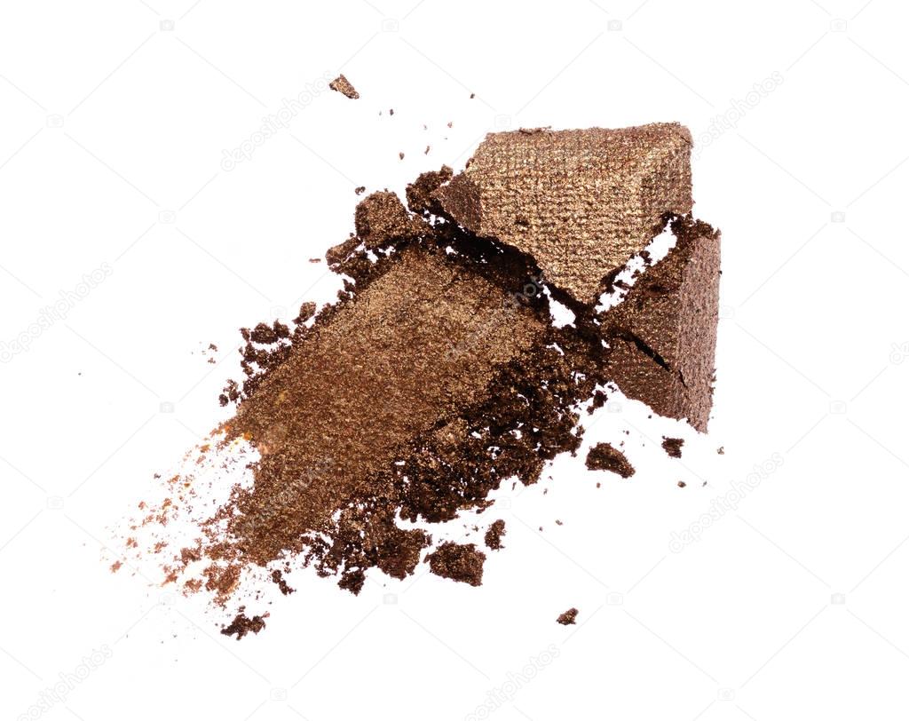 Smear of crushed shiny brown eyeshadow as sample of cosmetic product