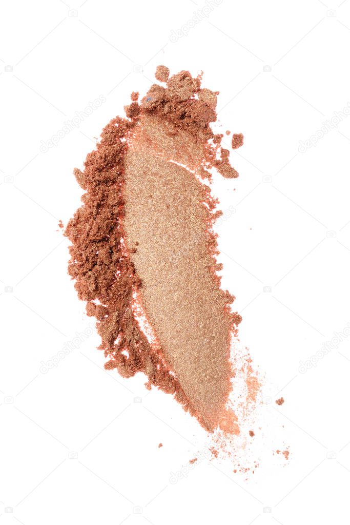 Smear of crushed beige eyeshadow as sample of cosmetic product