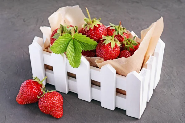 Fresh strawberry in white box with parchment paper — Stock Photo, Image