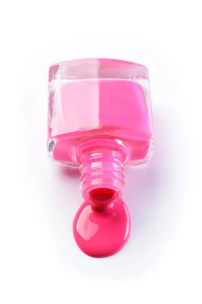 Lac de unghii roz vărsat ca probă de produs cosmetice — Fotografie, imagine de stoc