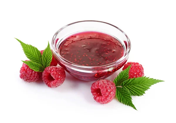 Close up view jam in glass bowl with fresh ripe raspberry and leaves — Stock Photo, Image