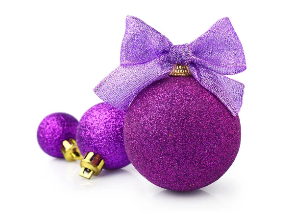 Beautiful glittering purple christmas balls with bright ribbon — Stock Photo, Image