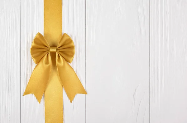 Golden ribbon with bow for decoration gift box — Stock Photo, Image