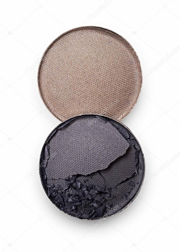 Gray and beige crushed eyeshadow for makeup as sample of cosmetic product