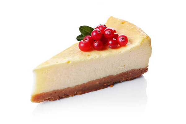 Close-up slice of delicious homemade cheesecake with fresh cranberry isolated on white backgroun