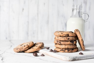 Chocolate chip cookies with bottle of mink for tasty break