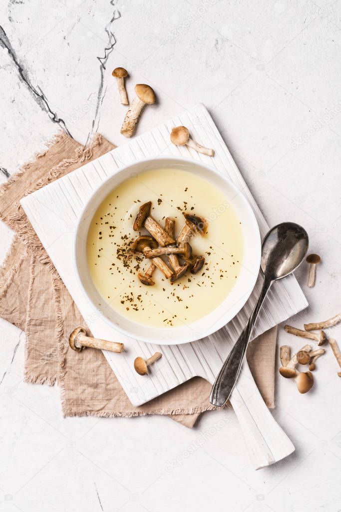 Bowl of vegetarian cream soup with forest mushrooms